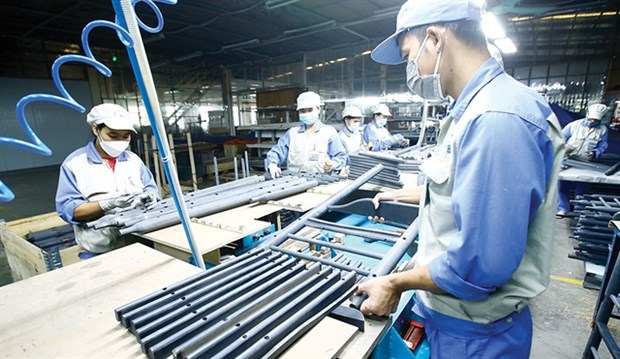 Workers making furniture at a Woodland's factory. (Photo: baodautu.vn)