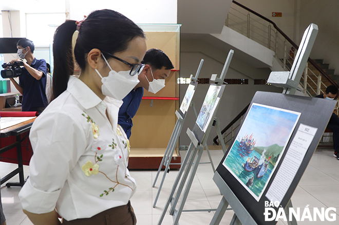 Visitors are seen at the exhibition.