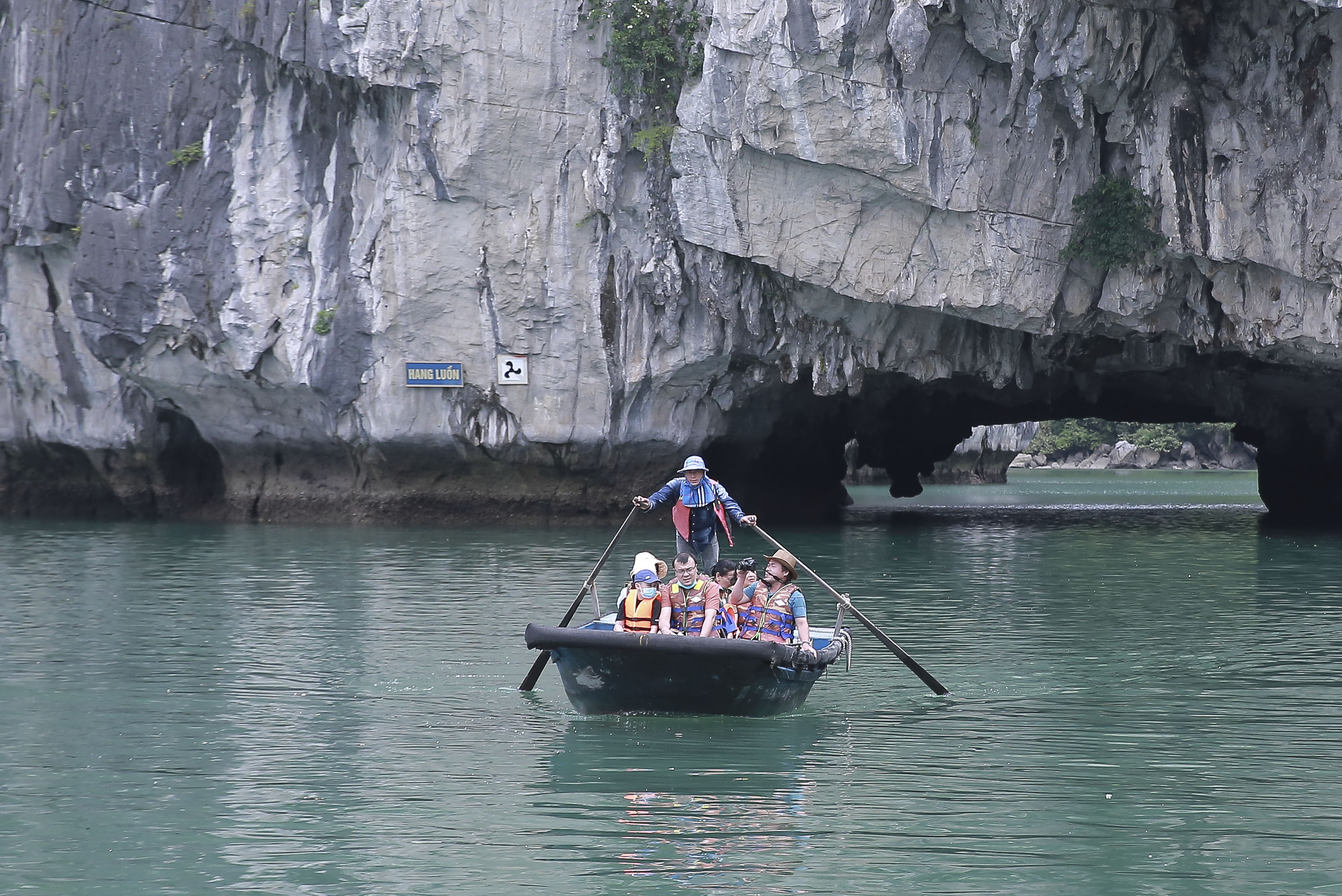 Tourists experience a boat tour in Ha Long Bay