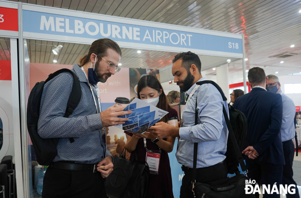 Delegates learn about information at the Melbourne Airport's pavilion.