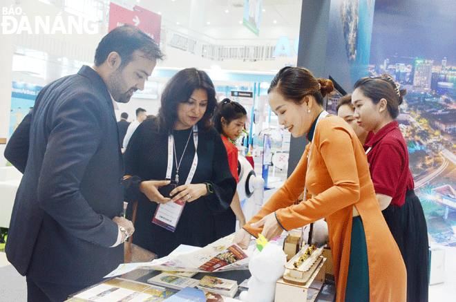 Businesses learning about investment and cooperation information at the Asian aviation and tourism exhibition which is part of a series of Routes Asia 2022's events. Photo: THU HA