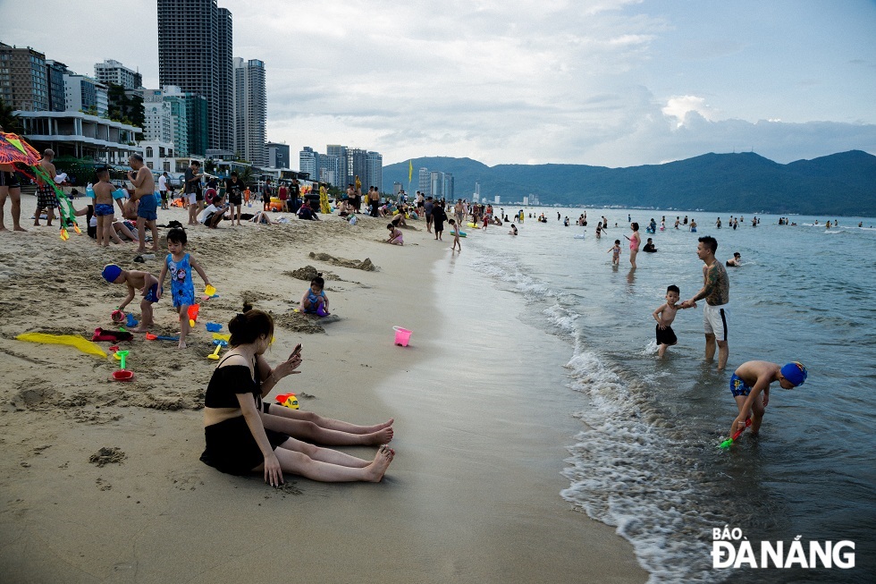 Locals and tourists are seen swimming in sea 