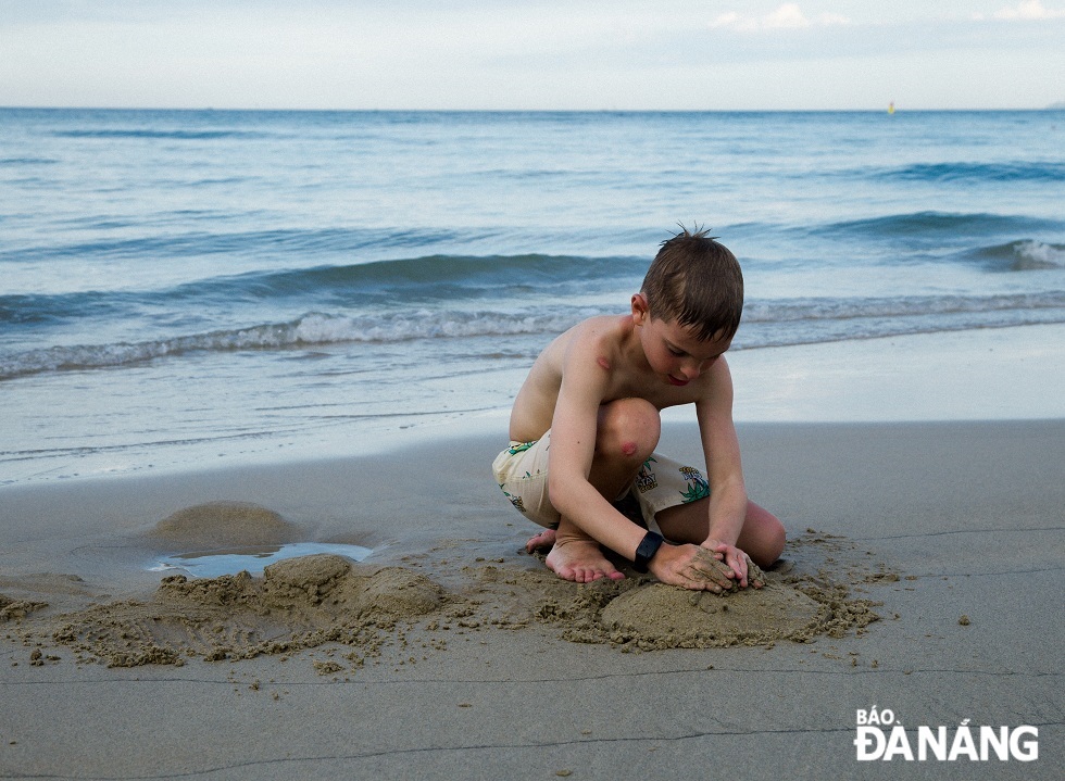 A Russian boy playing on the beach