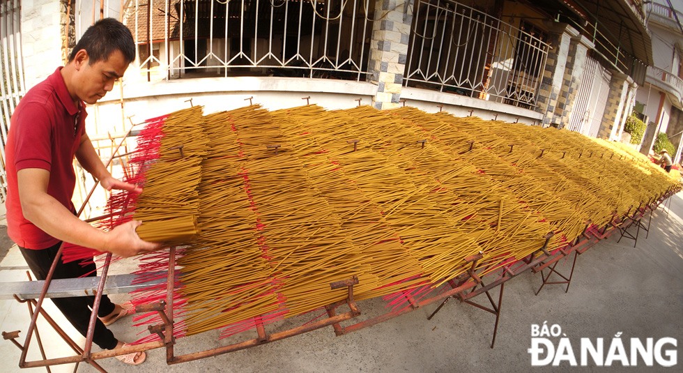 Incense sticks are dried in the sun