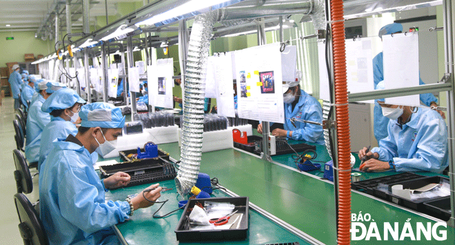 Da Nang is giving priority to high technology, an economic sector for driving the local growth. IN THE PHOTO: Manufacturing activities at the Trung Nam Electronic Manufacturing Services Joint Stock Company (Trungnam EMS) in the Hi-Tech Park located in Hoa Vang District. Photo: MAI QUE