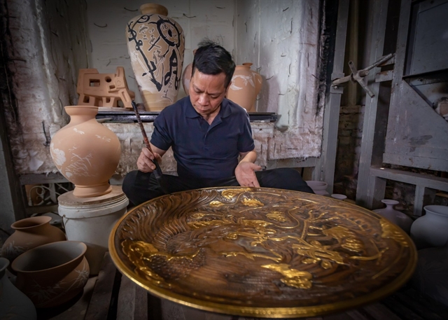 Artist Nguyễn Hùng has pursued ceramics for the past 40 years. — Photo courtesy of the artisan