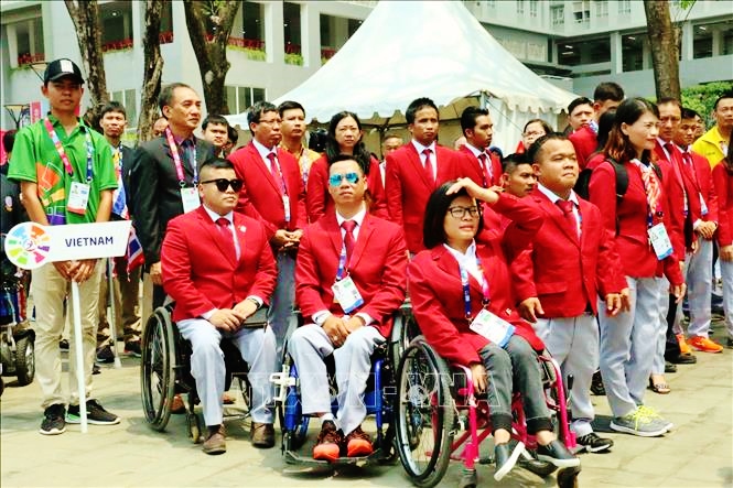 Đoàn Thể thao Người Khuyết tật Việt Nam tại Asian Para Games lần thứ 9 năm 2018 tham dự Lễ Thượng cờ. Ảnh minh họa: TTXVN