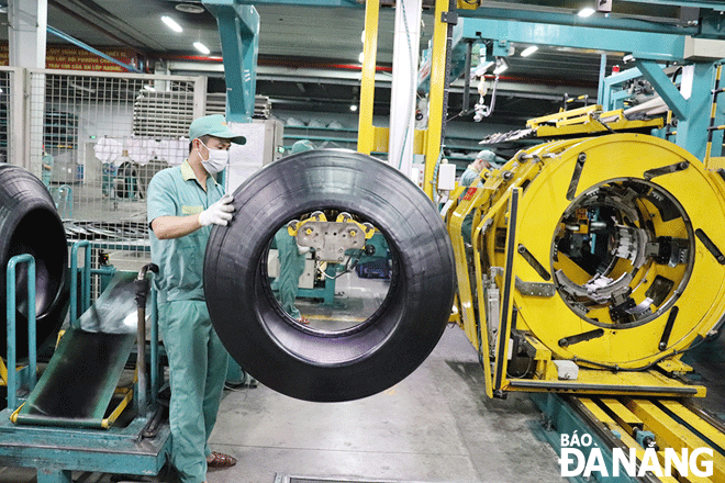 Workers at the Da Nang Rubber JSC based in the Hoa Khanh Industrial Park, Lien Chieu District. Photo: KHANH HOA