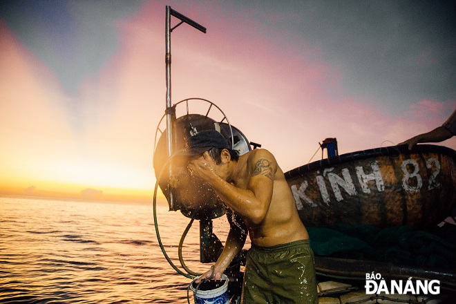 As dawn breaks, fishermen take a rest