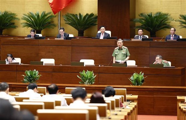 Minister of Public Security Gen. To Lam answers questions from lawmakers on August 10. (Photo: VNA)
