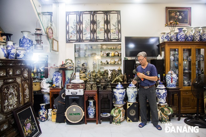 Mr. Loc's 'miniature museum' is currently storing several hundred antiques dating back many generations.