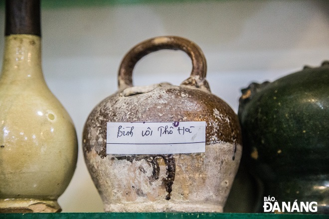 The pots of betel nut dating back to the Le Dynasty are labeled by Mr. Loc with quite enough information