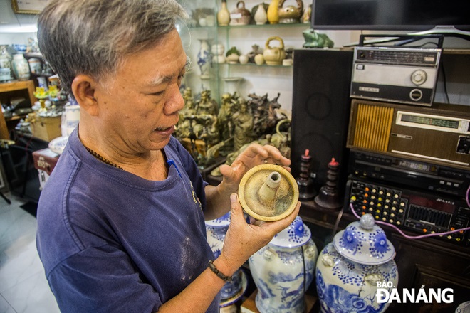 An oil lamp is up to 500 years old and is carefully preserved by him.