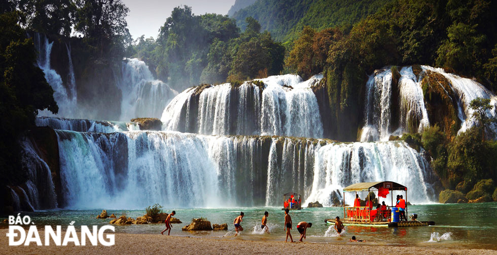 Local kids playing in the water at the foot of the Ban Gioc Waterfall