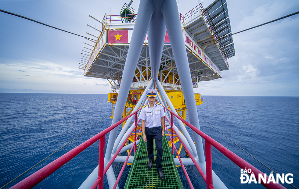 A naval officer working on the rig