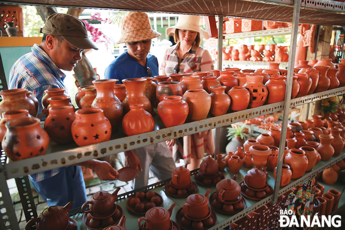 A wide range of pottery products are on sale at the village.