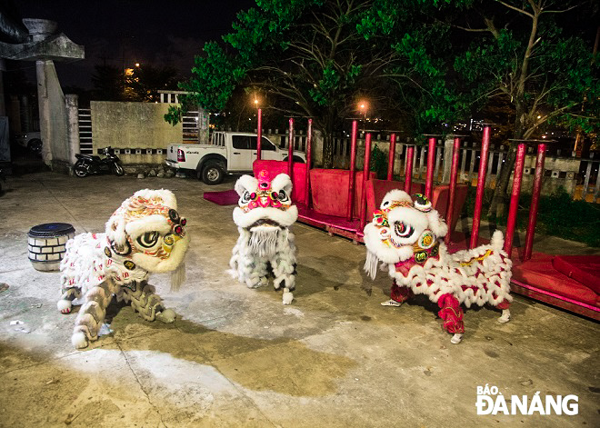 Members of the Tu Cau lion dance team practicing until late at night.