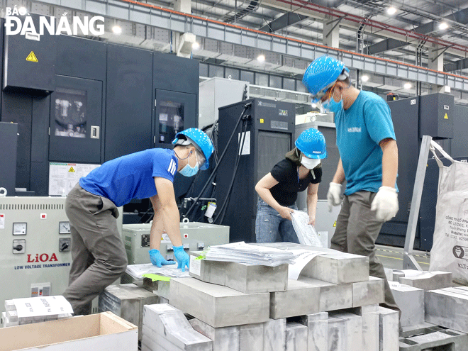 Engineers are seen working at the Sunshine aerospace components plant in the Da Nang Hi-Tech Park. Photo: TRIEU TUNG