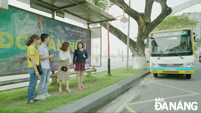 Passengers waiting for a subsidised bus