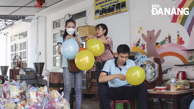 Young volunteers preparing for the Mid-Autumn Festival programme for children at the centre