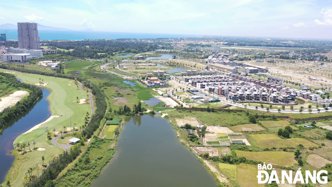 The urban space of Da Nang is expanded to the south to create development linkages with Quang Nam Province. IN THE PHOTO: An urban area along the Co Co River is seen from above. Photo: TRIEU TUNG