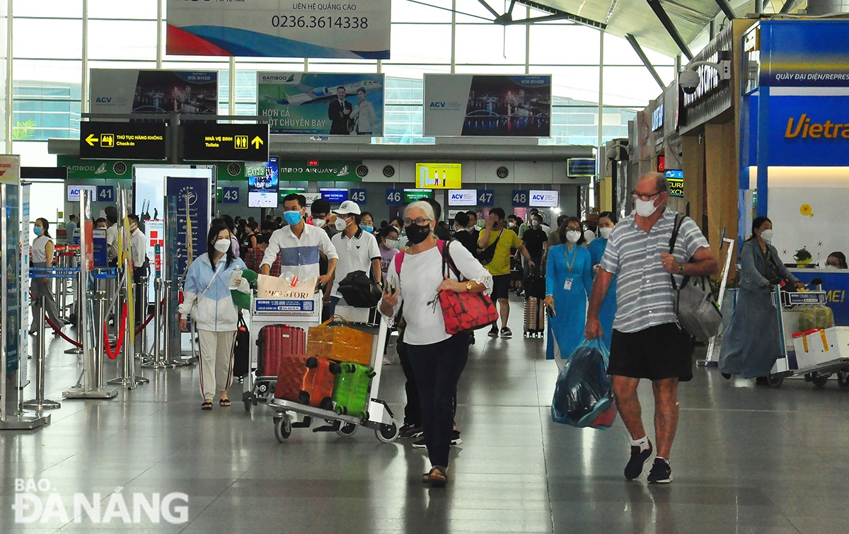 Air passengers are observed at Da Nang International Airport