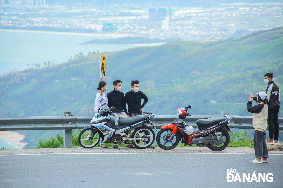 Young people love riding motorbikes along the Hai Van Pass to enjoy the beauty of majestic mountains.