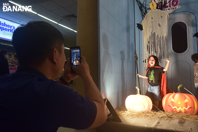 Many children are fascinated with posing for photos when they dress up for the first time on Halloween.