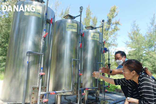 Functional units check the quality of treated wastewater before being reused for watering plants and regulating climate at a resort in Ngu Hanh Son District, Da Nang. Photo: HOANG HIEP