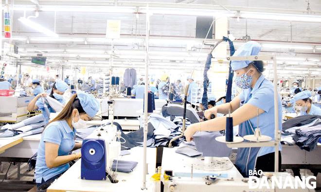  Production activities at the Hoa Tho Textile and Garment Corporation. Photo: Q.TRANG