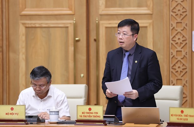 Thứ trưởng Bộ Thông tin và Truyền thông Nguyễn Thanh Lâm báo cáo công tác truyền thông chính sách. (Ảnh: Dương Giang/TTXVN)
