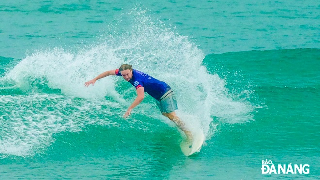 A contestant demonstrating his professional surfing techniques.