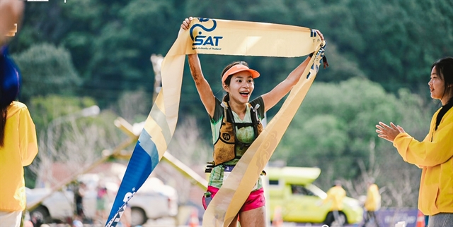 Hà Thị Hậu of Việt Nam celebrates her win in the Doi Inthanon Thailand by UTMB's women's 54km trail. Hậu won her first international competition. Photo of Doi Inthanon Thailand by UTMB