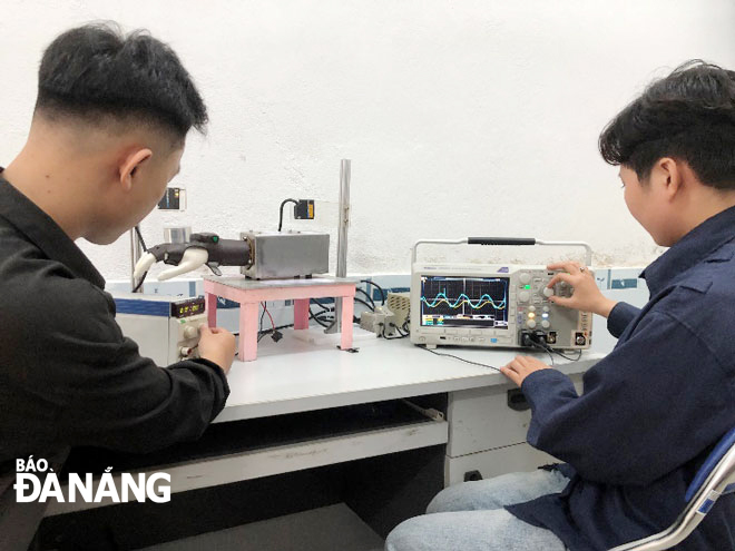 The group of students creating a device that assists people with hand tremors will perfect the features of the product with the goal of selling it to customers in the future. Photo: H.L