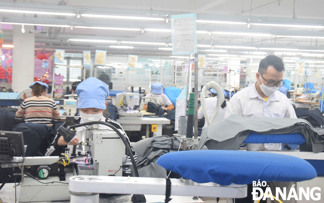 Workers are seen producing garments at the March 29 Textiles and Garments JSC. Photo: Q.TRANG