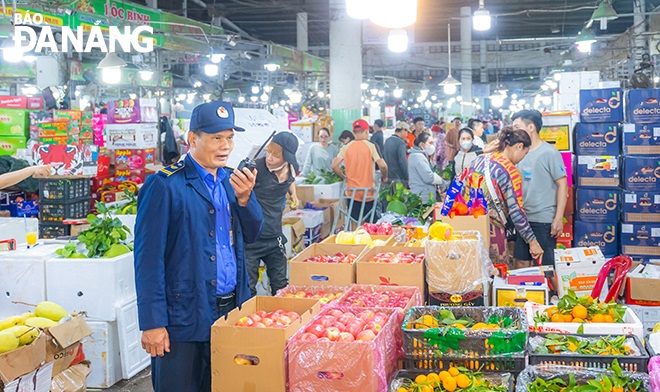 Members of  the market management board on duty early at the market