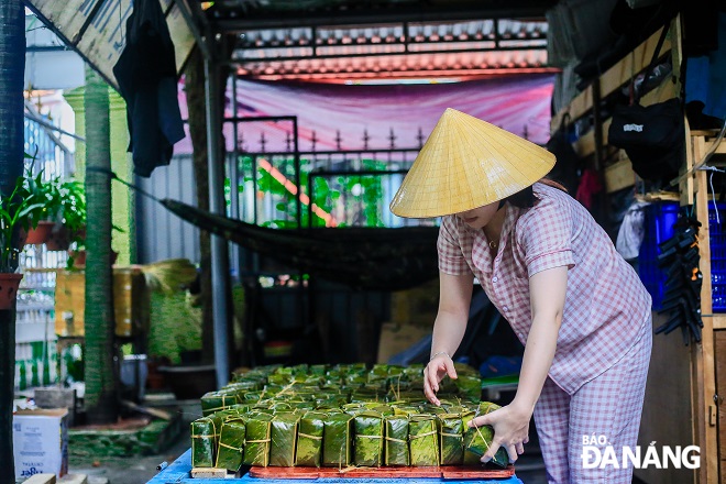 ‘Banh chung’ is neatly arranged in preparation for handing out them to the disadvantaged.