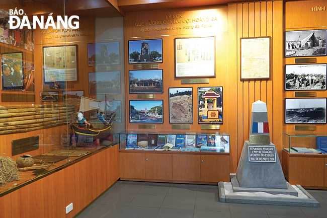 Some pictures at the exhibition space of documents and artifacts at the Hoang Sa Exhibition House. Photo: XUAN SON