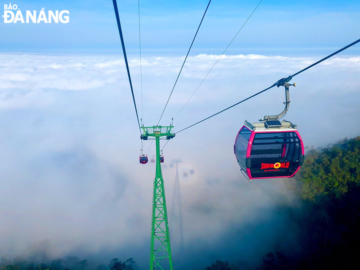 The floating clouds bring a new feeling to visitors in their journey to the land of 'Four seasons in one day'. Photo: NGUYEN TRUNG HIEU