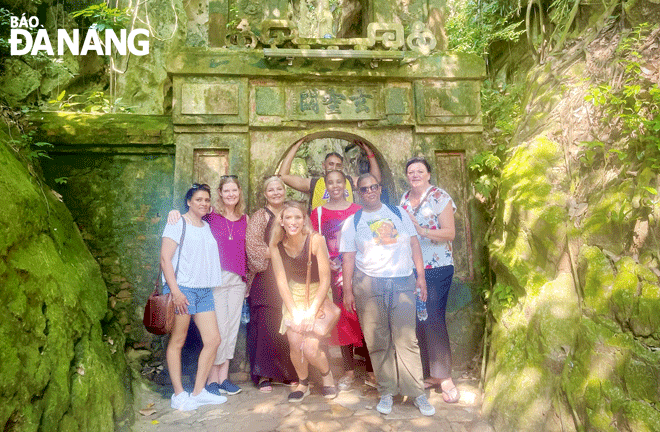 Hosting visitors from international travel agents and media agencies that conduct familiarisation trips (more commonly known as FAM trips) to explore Da Nang is the best way to connect with potential travellers and attract them to the city. In the photo: A FAM trip delegation from South African travel agencies conducting a survey at special national relic site Marble Mountains. Photo: THU HA