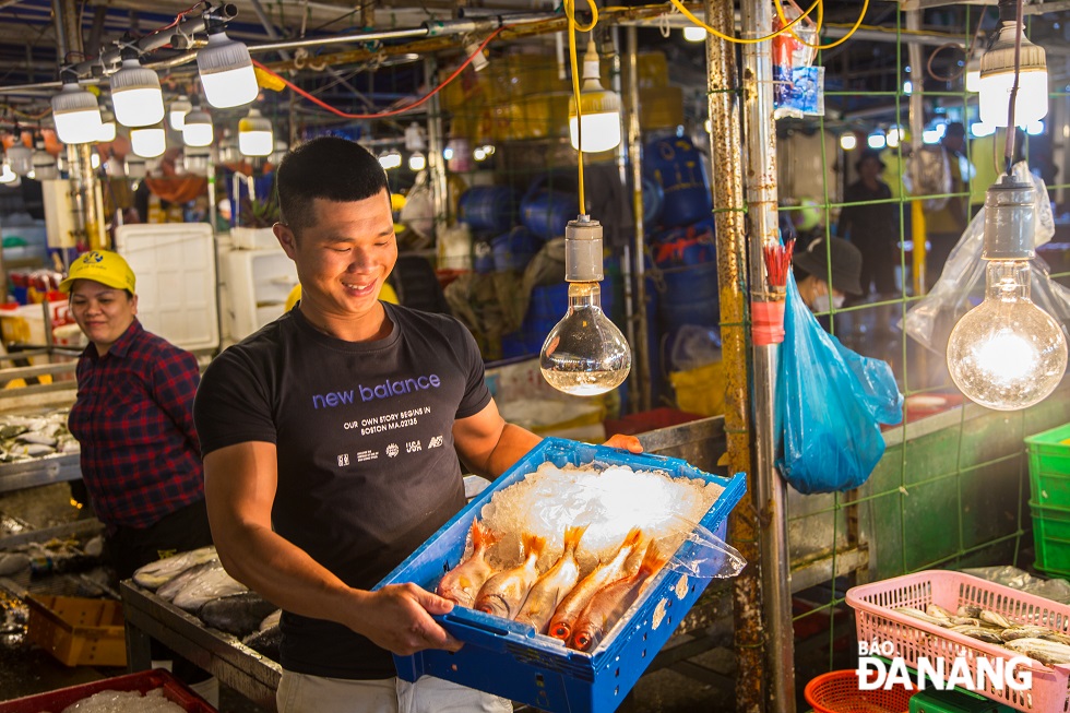 The joy of a fisherman with his fresh seafood
