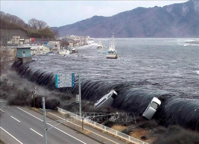 Cơn sóng thần lịch sử xảy ra sau thảm họa động đất tại thành phố Miyako, tỉnh Iwate, Nhật Bản ngày 11-3-2011. Ảnh: AFP/TTXVN