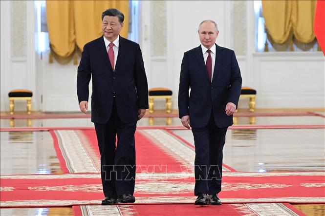 Chủ tịch Trung Quốc Tập Cận Bình (trái) và Tổng thống Nga Vladimir Putin tại Điện Kremlin ở Moskva tối 21/3/2023. Ảnh: AFP/TTXVN