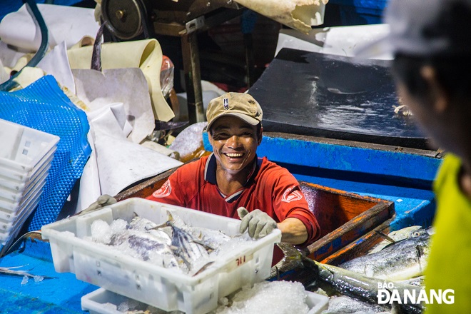 The happy smile of a fisherman at a harvest season of flying fish