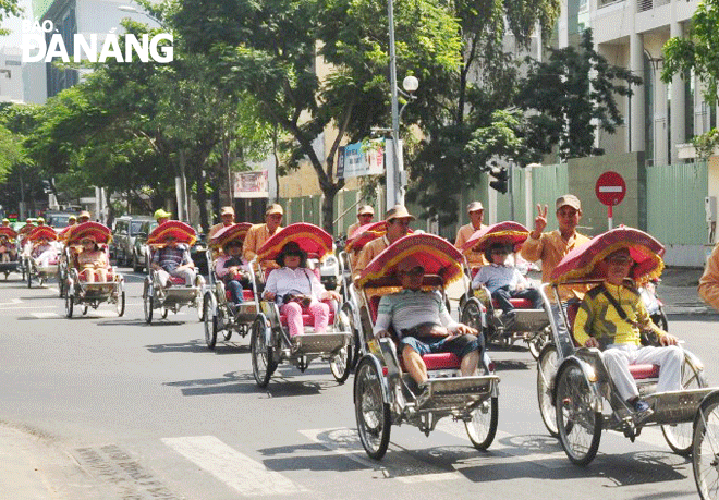 International visitors enjoying a city tour by cyclo