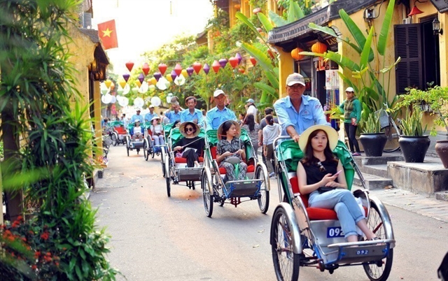 Tourists visit Hội An ancient town. On April 3, Hội An announced a proposal to enhance the control of guided tours to the ancient town, including charging tickets for all visitors and creating separate roads for locals and foreigners, which sparked significant backlash. — VNA/VNS Photo Minh Đức