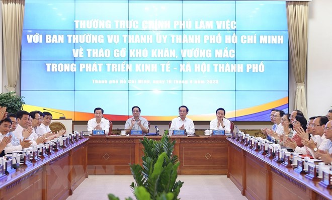 Thủ tướng Phạm Minh Chính chủ trì làm việc giữa Thường trực Chính phủ với Ban Thường vụ Thành ủy Thành phố Hồ Chí Minh. (Ảnh: Dương Giang/TTXVN)