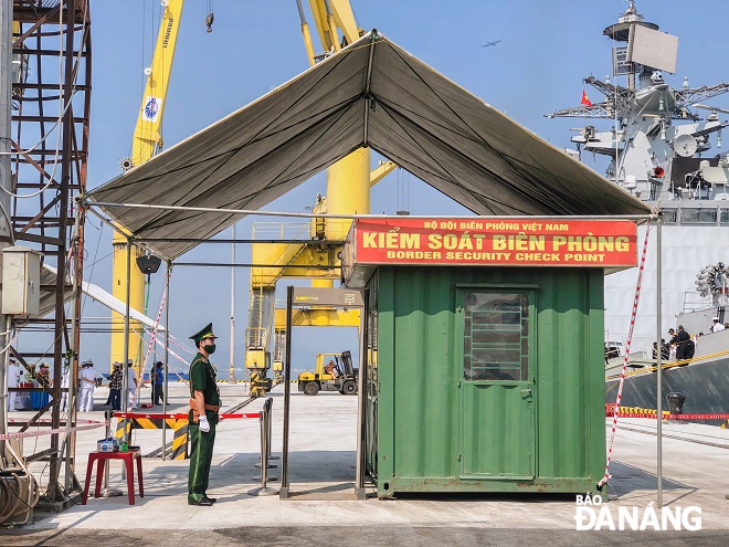 The city's Border Guard force closely check the entrance and exit at the port