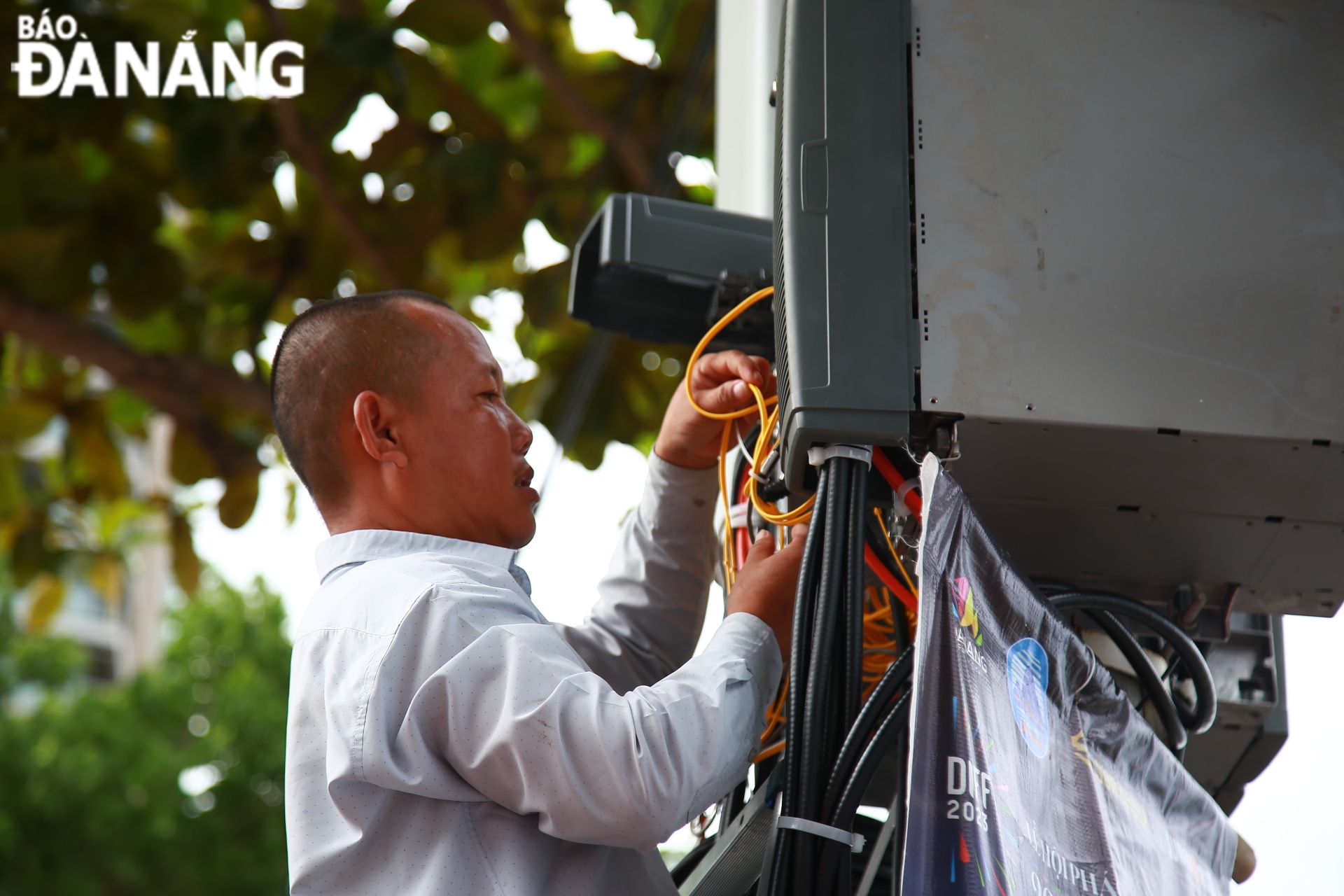 A technician checks a BTS.