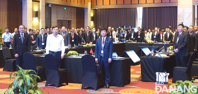 Delegates attending the opening session of the 42nd meeting of the ASEAN Committee on Disaster Management (ACDM) perform the ASEAN flag salute ceremony, June 13, 2023. Photo: HOANG HIEP